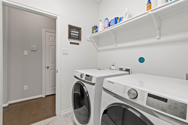 clothes washing area featuring washing machine and dryer