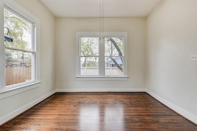 unfurnished dining area featuring dark wood-type flooring