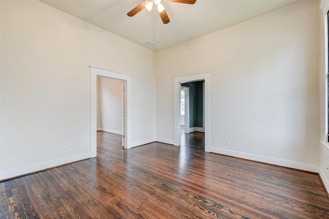 unfurnished room featuring ceiling fan and dark hardwood / wood-style floors