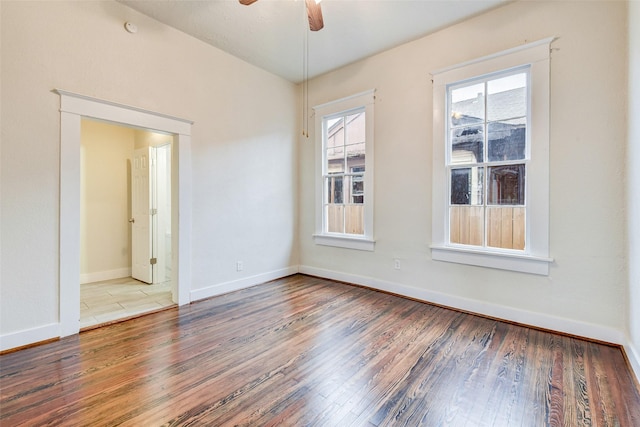 unfurnished room with ceiling fan and wood-type flooring