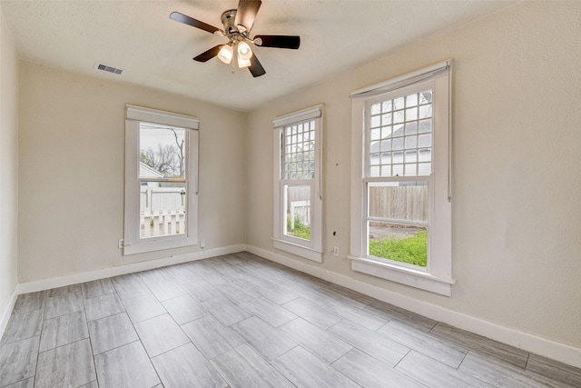 spare room featuring ceiling fan