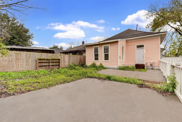 back of property with a patio