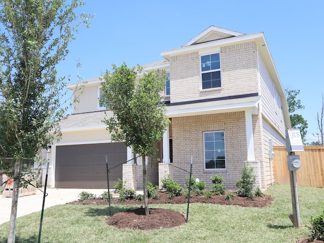 view of front of property featuring fence, a front lawn, brick siding, a garage, and concrete driveway