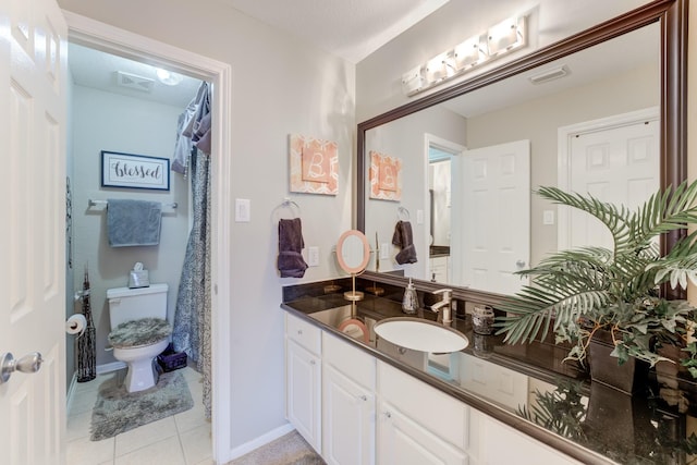 bathroom with tile patterned floors, toilet, and vanity