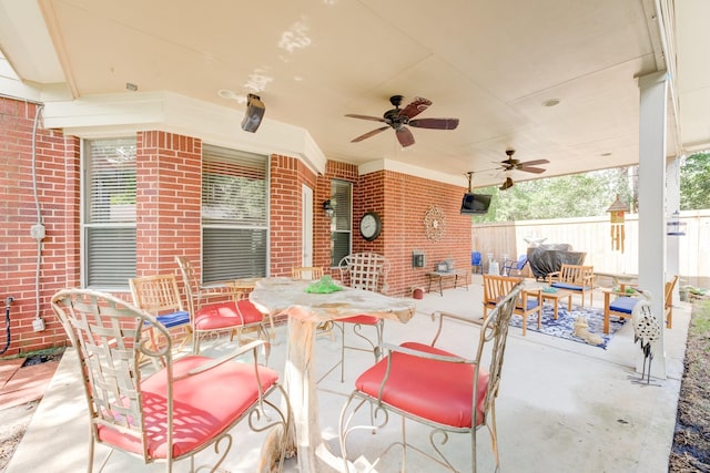 view of patio featuring ceiling fan