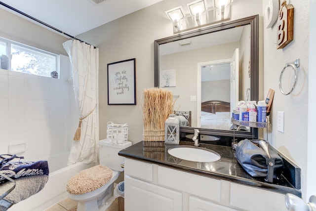 full bathroom featuring tile patterned floors, toilet, vanity, and shower / bathtub combination with curtain