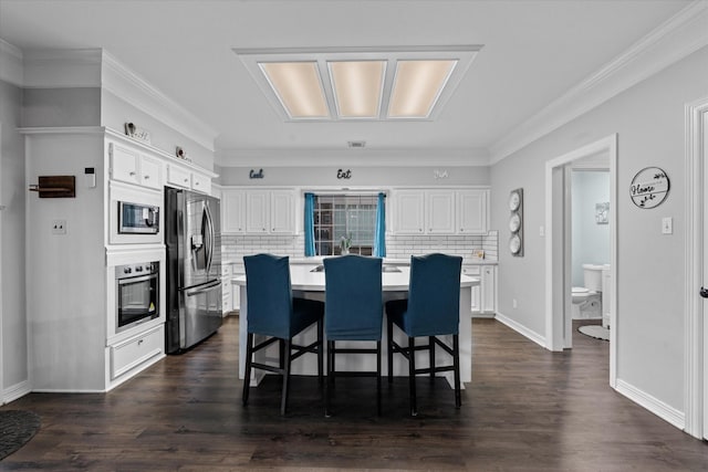 dining room featuring ornamental molding and dark hardwood / wood-style floors