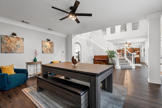 dining room featuring crown molding, ceiling fan, and dark hardwood / wood-style flooring