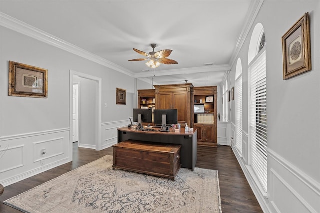 office area with dark hardwood / wood-style flooring, ornamental molding, and ceiling fan