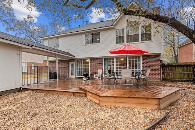 back of house with a wooden deck