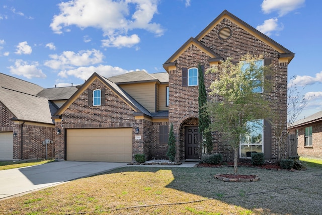 view of property featuring a garage and a front lawn