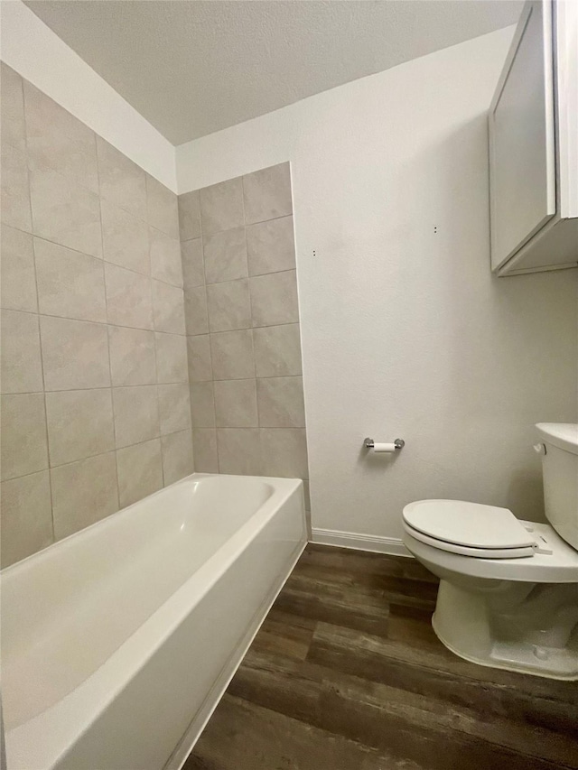 bathroom featuring toilet and wood-type flooring