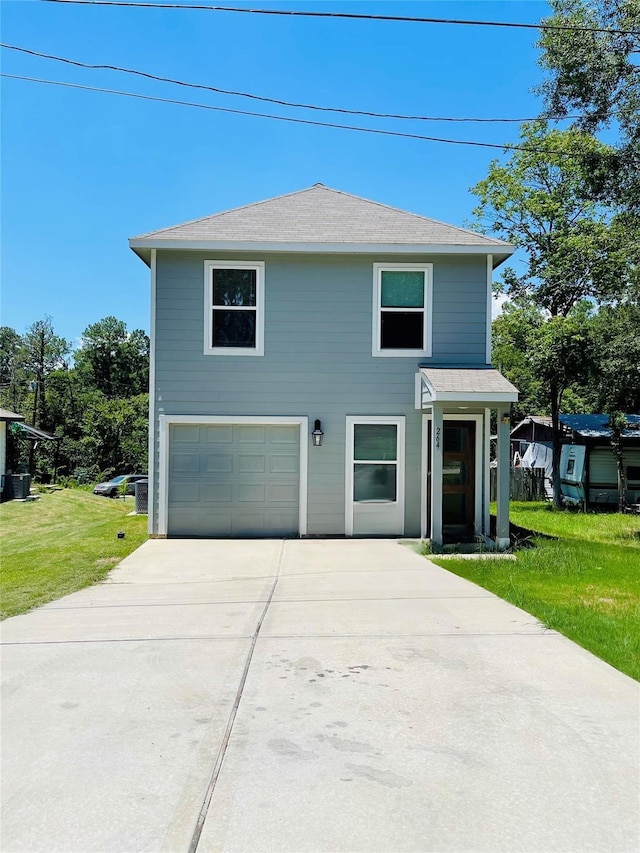 view of front facade featuring a garage and a front lawn