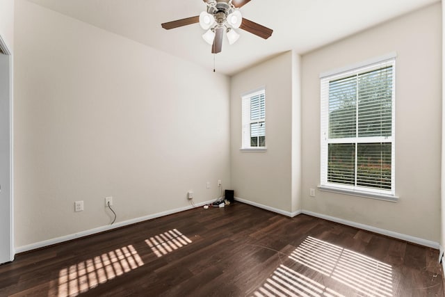 spare room featuring dark hardwood / wood-style floors and ceiling fan