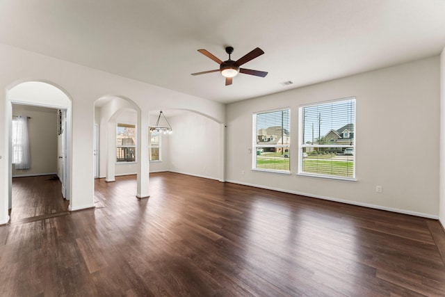 spare room with ceiling fan and dark wood-type flooring