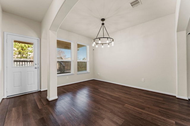 unfurnished dining area featuring dark hardwood / wood-style floors