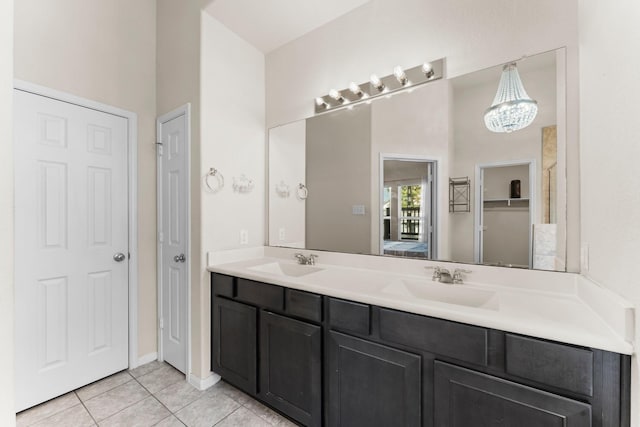 bathroom with tile patterned flooring and vanity