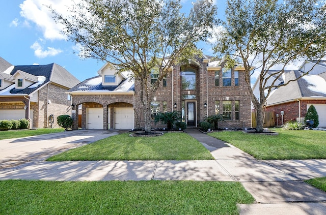 view of front facade with a garage and a front yard