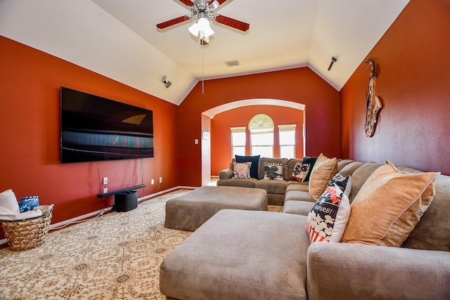 carpeted living room featuring ceiling fan and vaulted ceiling