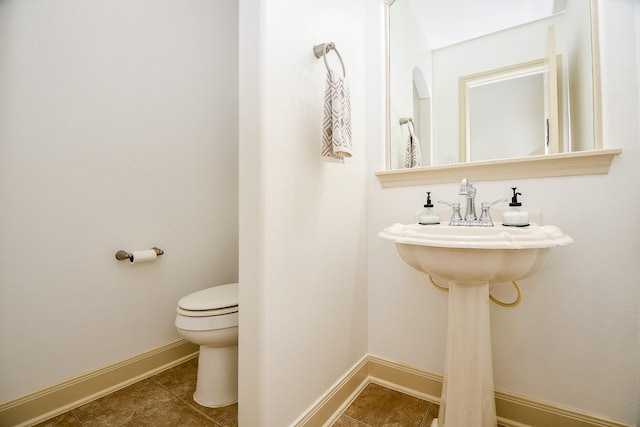 bathroom featuring tile patterned floors and toilet