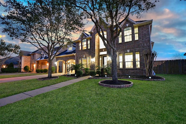 view of front of property with a yard