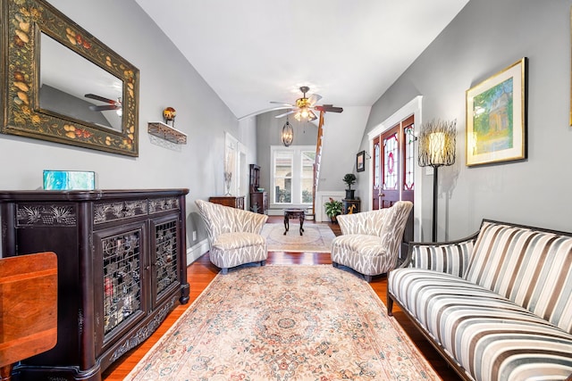 living room featuring vaulted ceiling, ceiling fan, and hardwood / wood-style floors