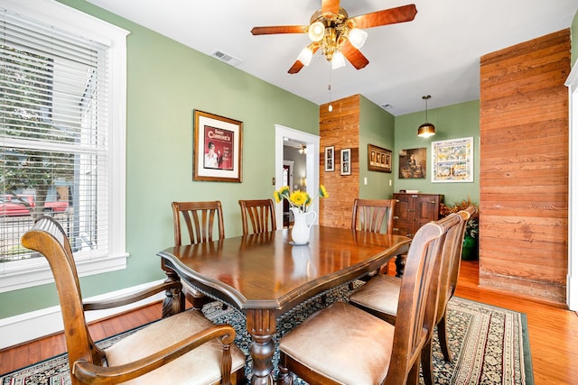 dining space featuring light hardwood / wood-style flooring and ceiling fan