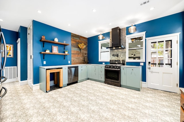 kitchen featuring wall chimney exhaust hood and stainless steel appliances