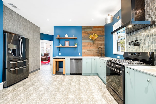 kitchen with appliances with stainless steel finishes, sink, and island range hood