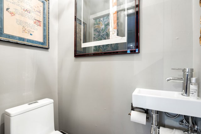 bathroom with toilet and sink