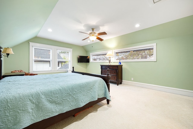 carpeted bedroom featuring ceiling fan and lofted ceiling