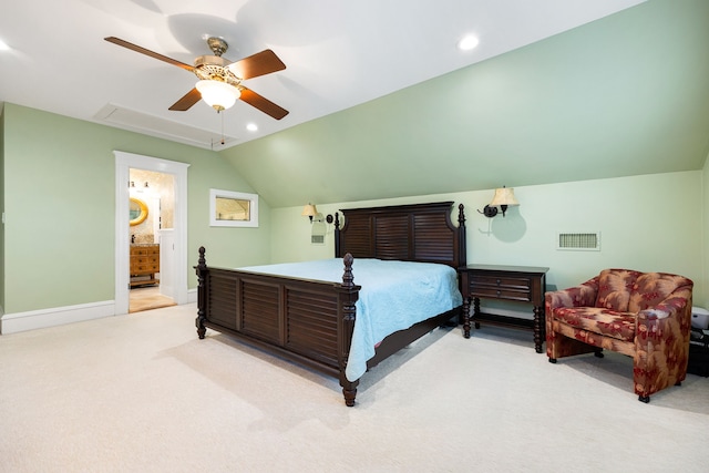 bedroom with light carpet, lofted ceiling, ceiling fan, and ensuite bathroom