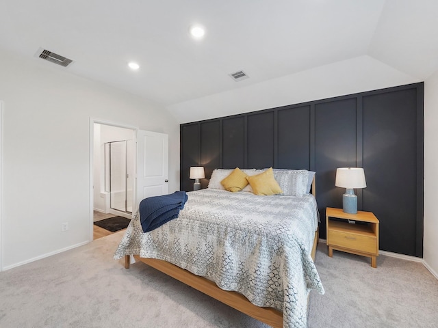 carpeted bedroom featuring ensuite bathroom