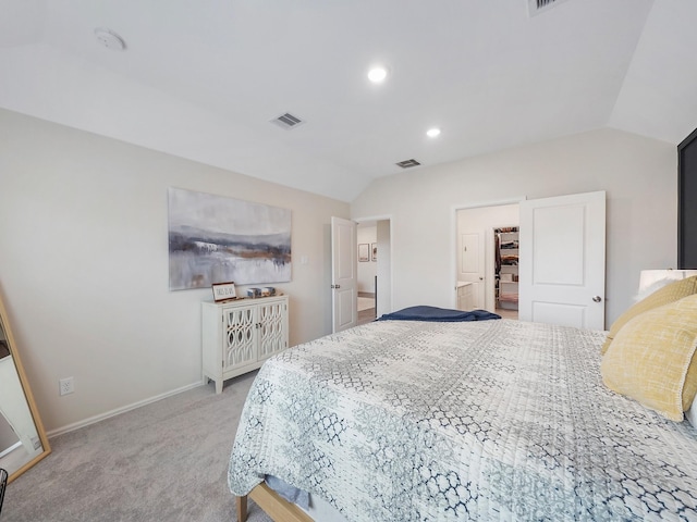 carpeted bedroom with vaulted ceiling