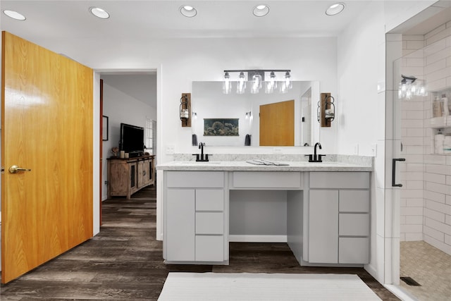 bathroom with vanity, hardwood / wood-style flooring, and an enclosed shower