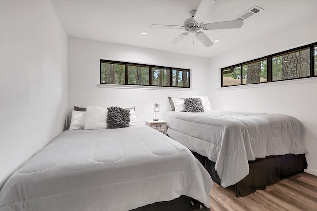 bedroom featuring ceiling fan and wood-type flooring