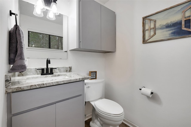 bathroom with toilet and vanity