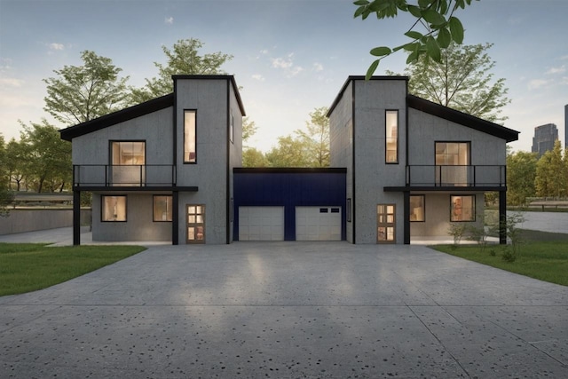 modern home featuring a balcony and a garage