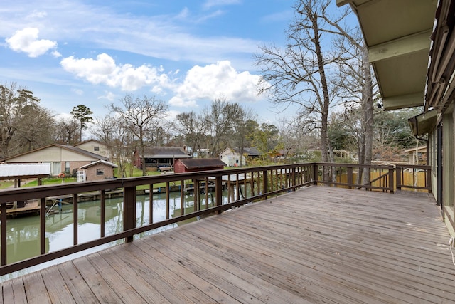 deck featuring a water view and area for grilling