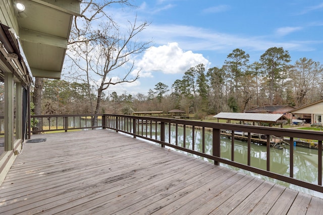 wooden terrace featuring a water view