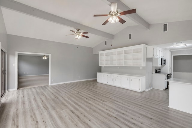 unfurnished living room with lofted ceiling with beams, light hardwood / wood-style floors, and ceiling fan