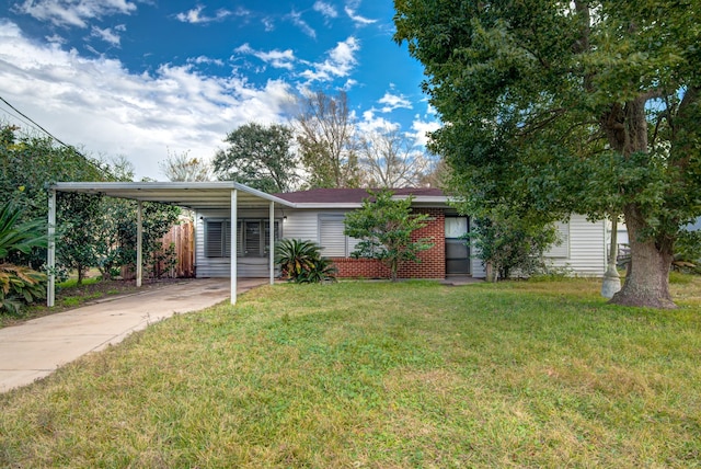 view of front facade with a carport and a front lawn