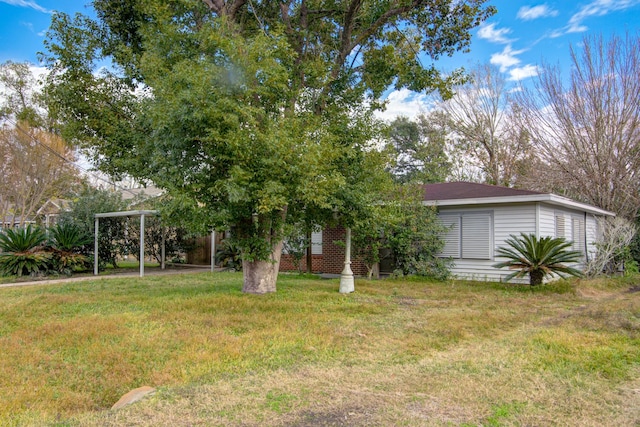 view of yard featuring a carport