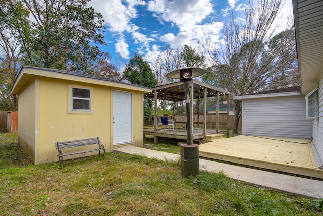 exterior space featuring a storage unit and a wooden deck