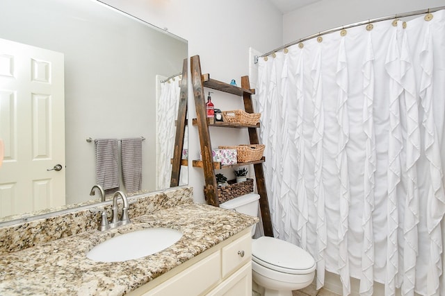 bathroom with toilet and vanity