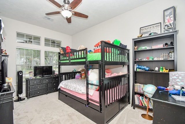 bedroom featuring ceiling fan and light carpet