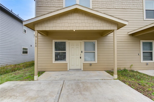 doorway to property featuring a patio