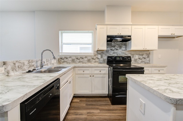 kitchen featuring sink, black appliances, white cabinetry, and tasteful backsplash