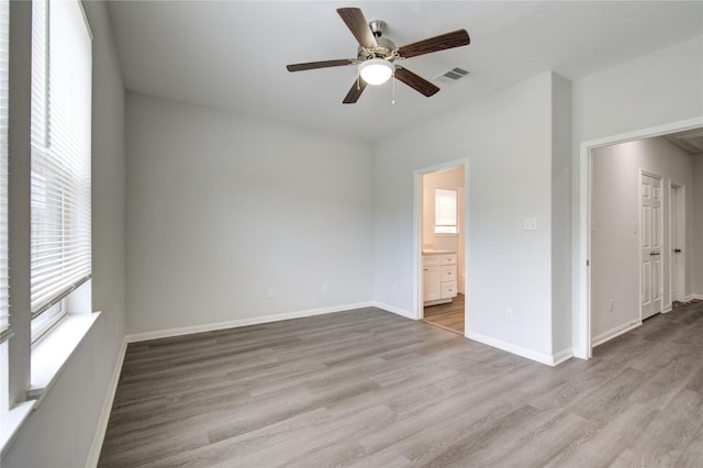 spare room featuring light wood-type flooring and ceiling fan