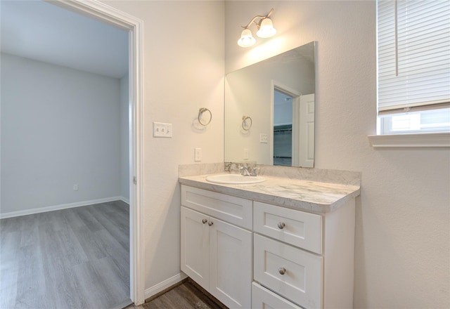 bathroom featuring vanity and wood-type flooring